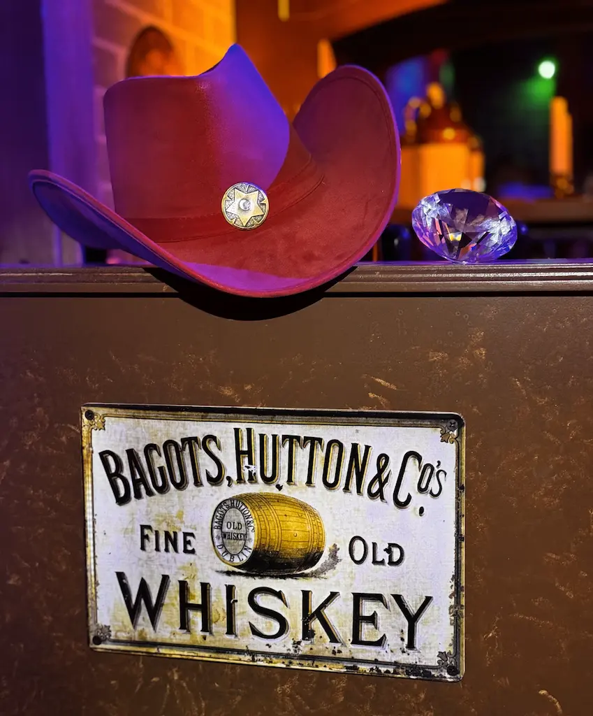 Scarlet Sue's famous red hat sits atop a beer tap next to the giant Yukon-Polaris diamond