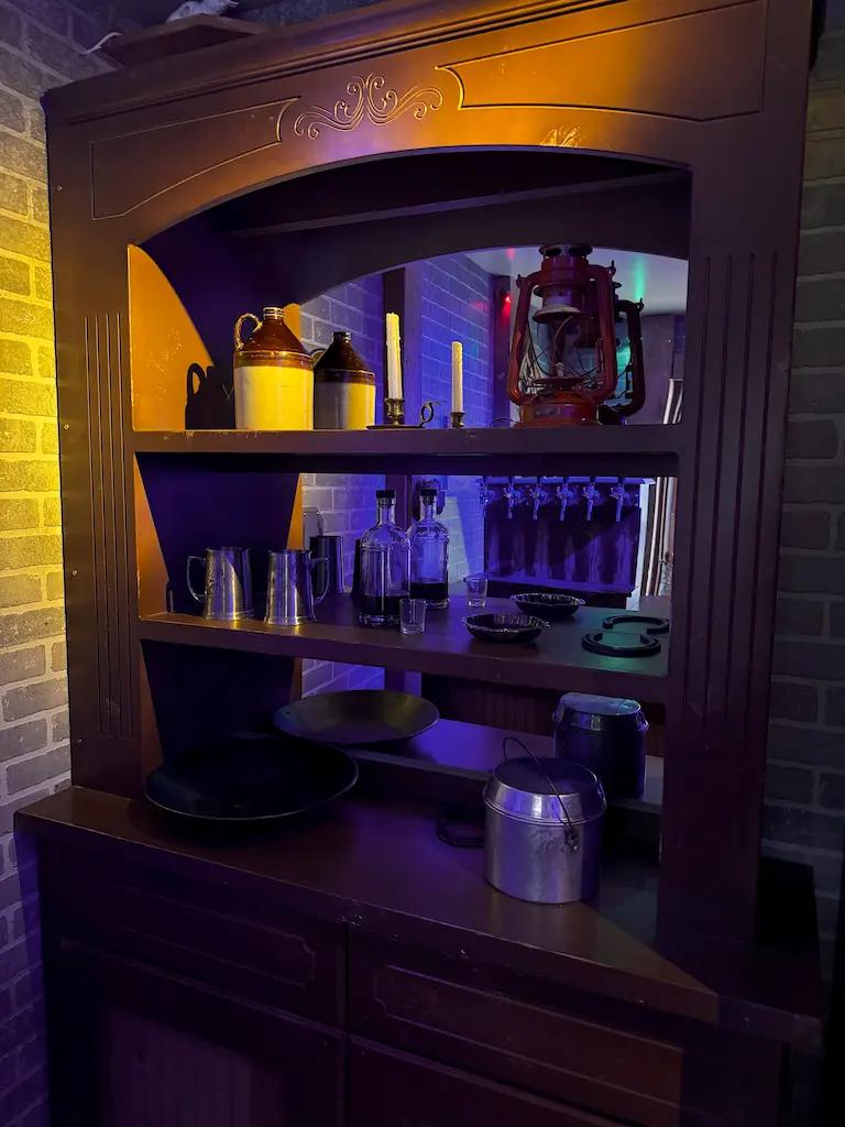 Shelves behind the bar at the Gold Rush Saloon might hold some clues