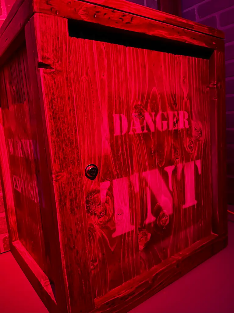 Crate is labelled "DANGER TNT"